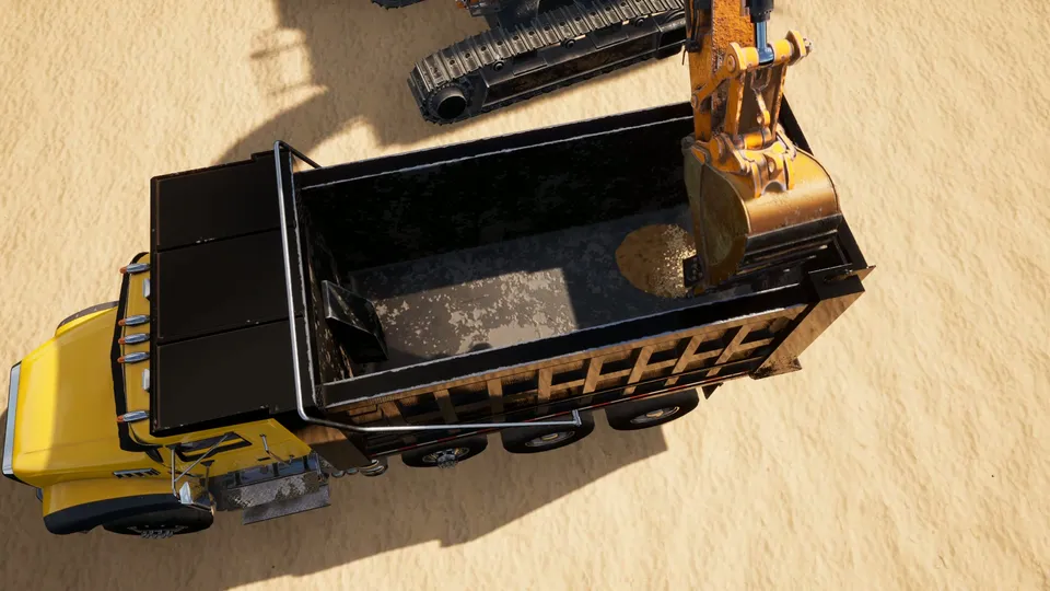 The excavator bucket over a truck bed from above