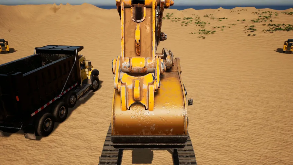 An excavator beside a dump truck on a sandy island