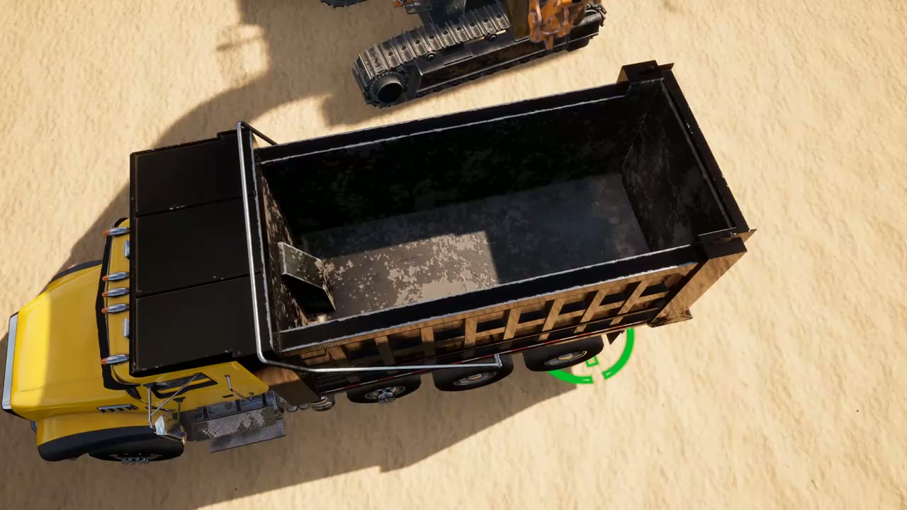 Sand pouring from the bucket into a truck bed